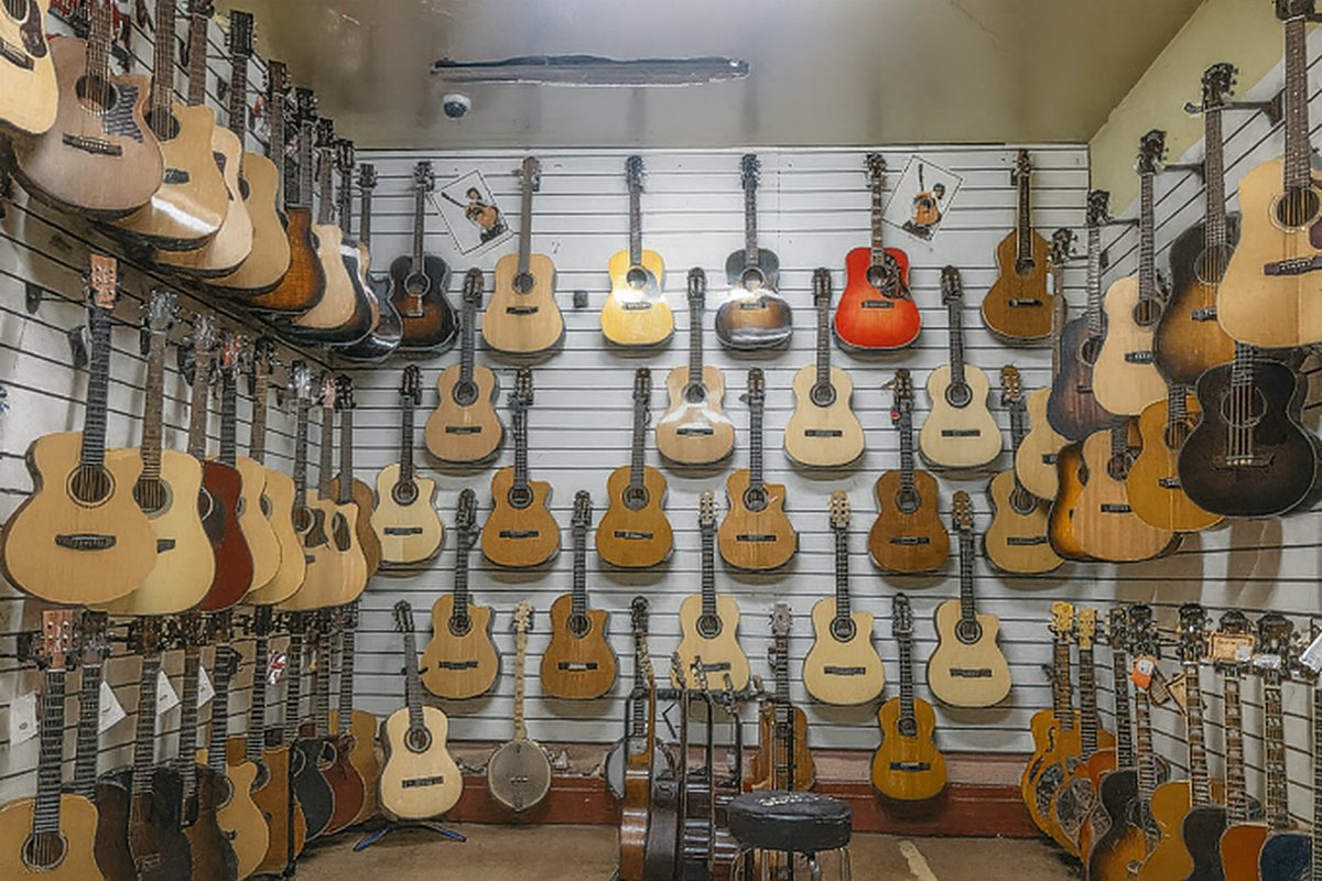 The acoustic guitar wall inside the Scarlett Music showroom, Footscray